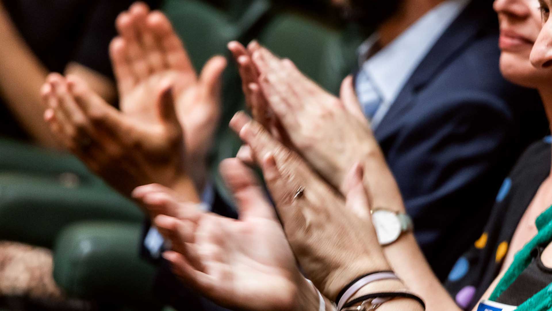 Close up photo of hands clapping