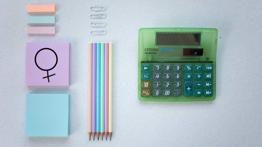 Photo of a calculator and coloured post-it notes