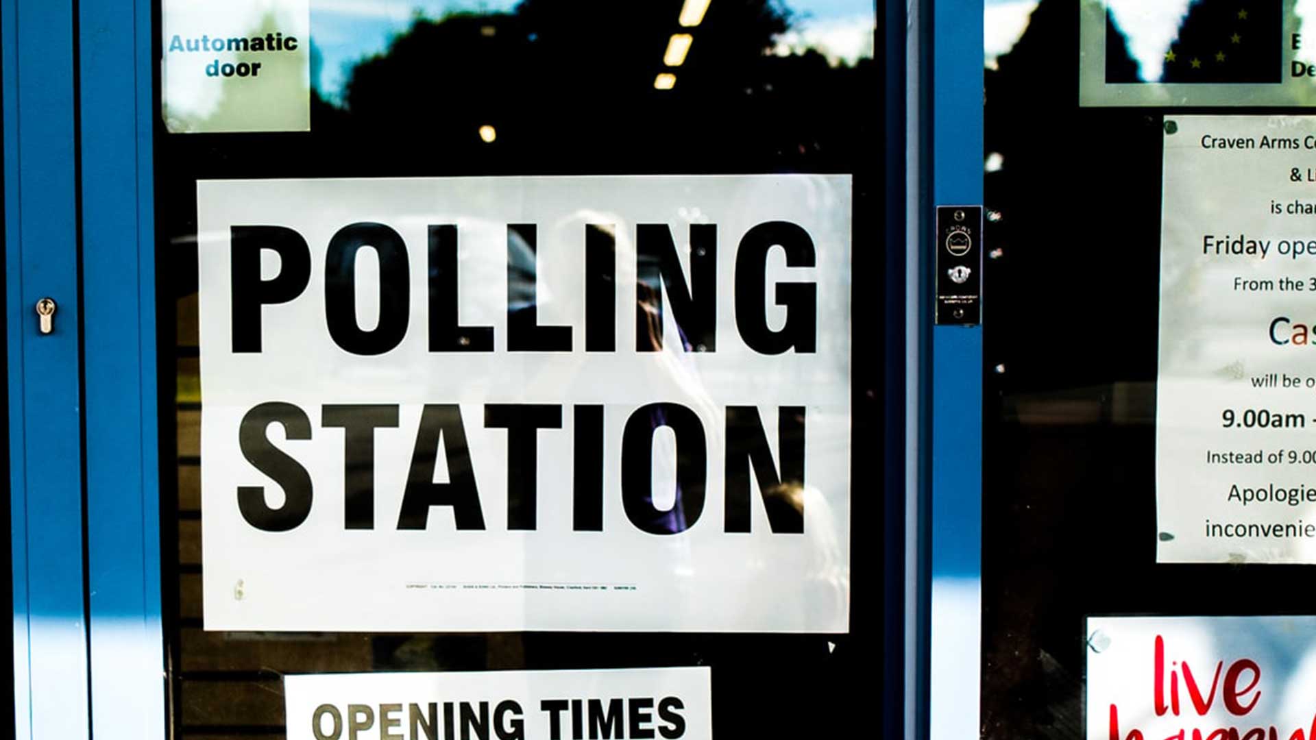 Door with a sign that reads "POLLING STATION"