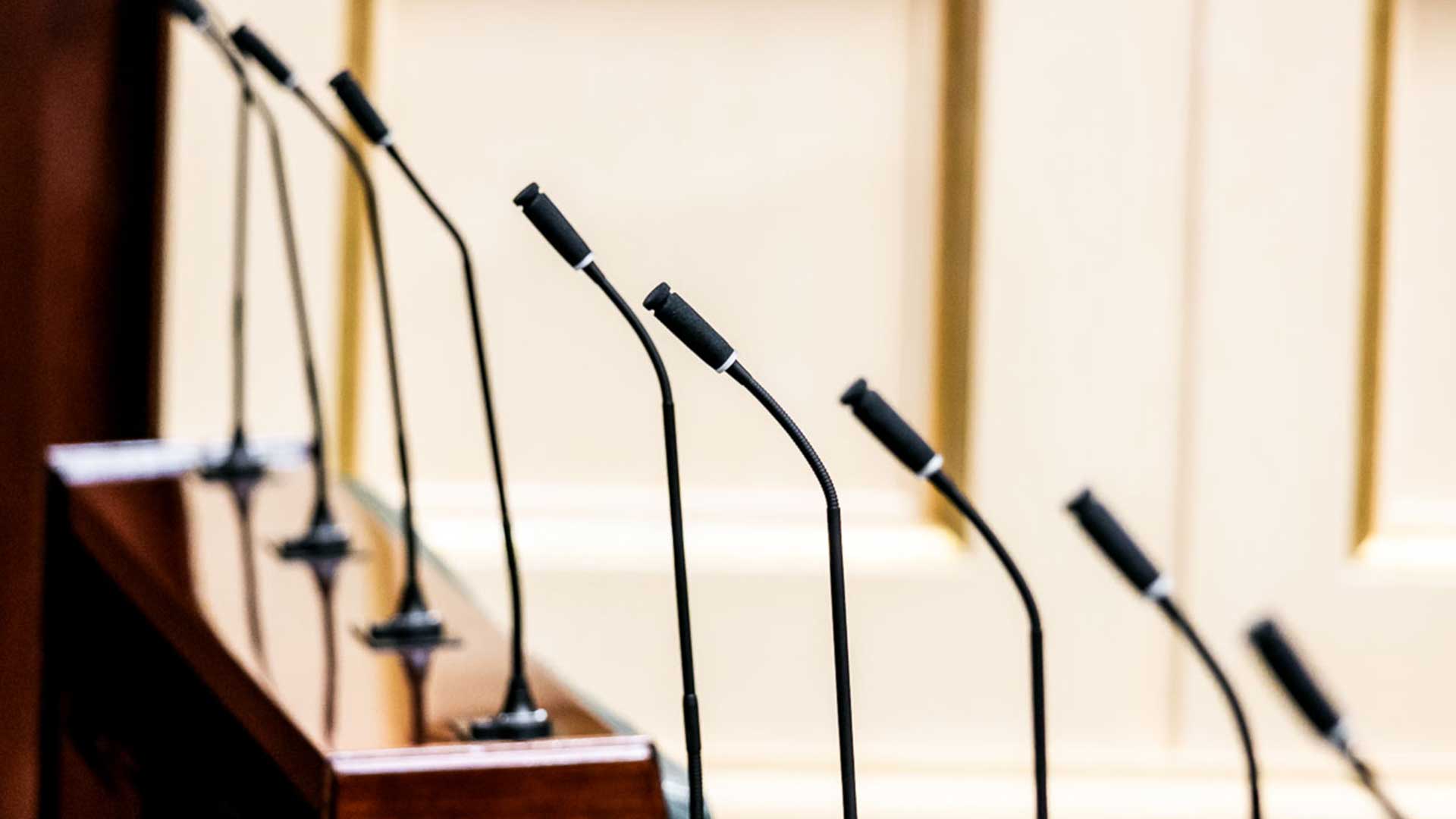 Row of microphones in Parliament chamber