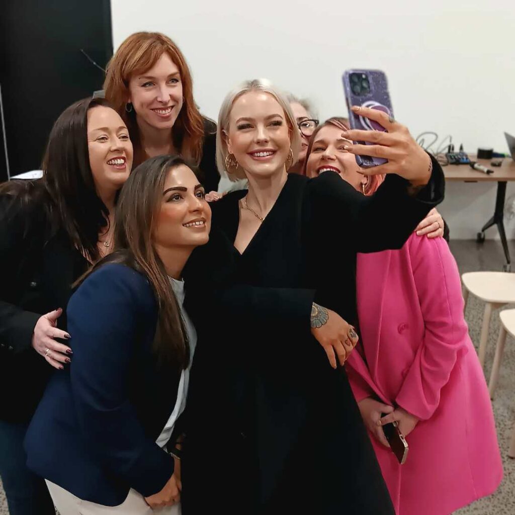 Group of five diverse women taking a selfie together