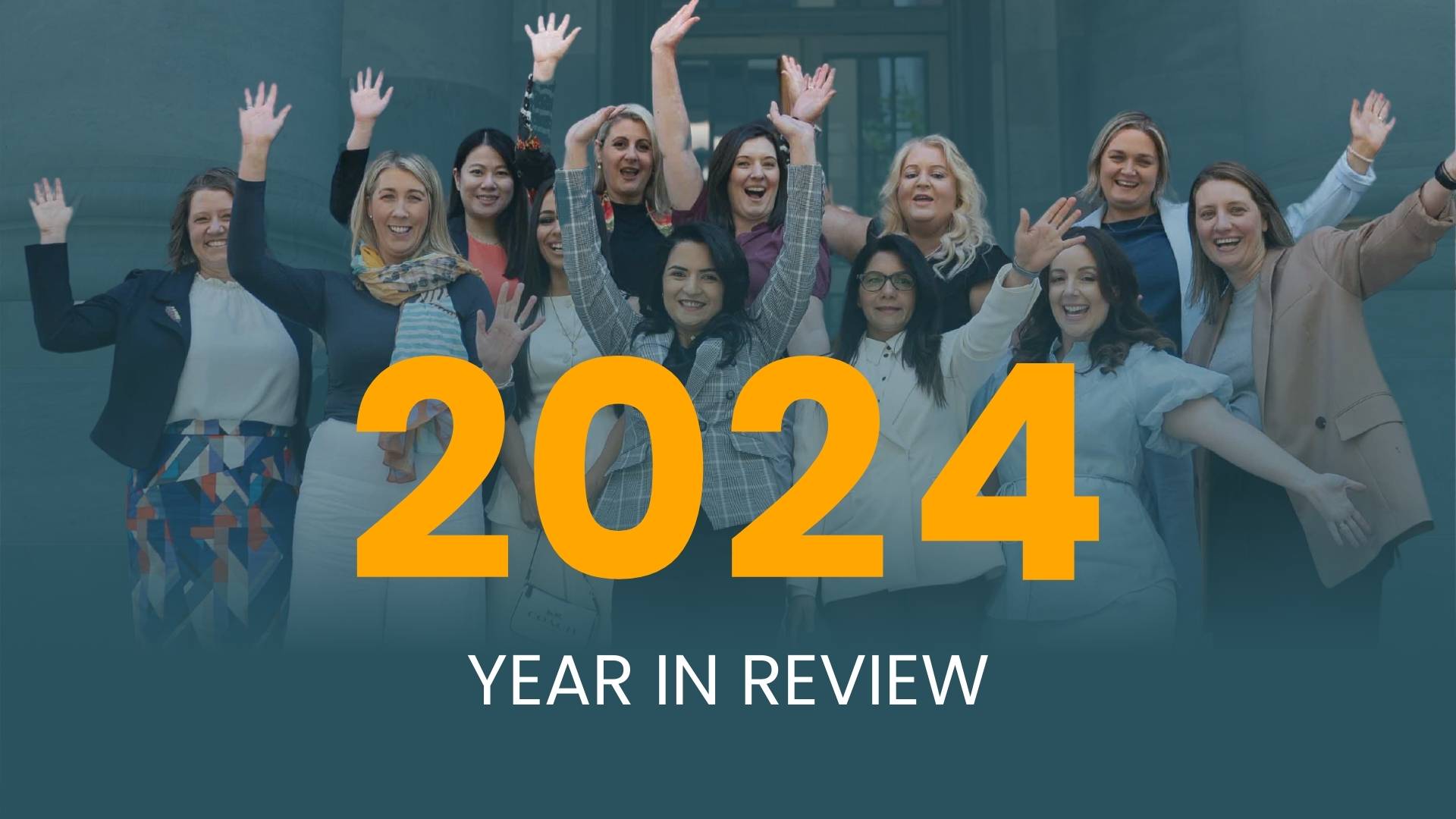 Crowd of diverse smartly dressed women cheering with their hands in the air, overlaid with text reading "2024 year in review"