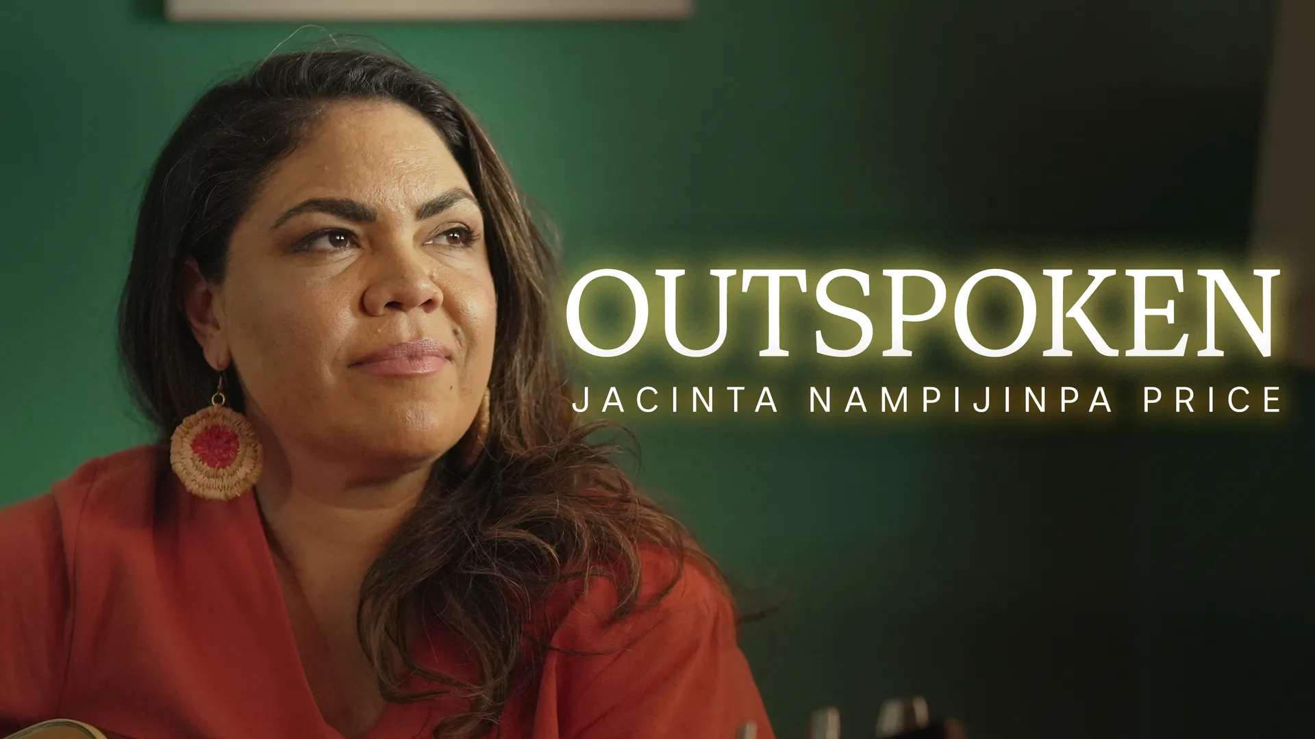 Photo of Jacinta Nampijimpa Price, an Aboriginal woman with long dark hair, wearing a rust coloured blouse and large round earrings, against a green background. Superimposed are the words: OUTSPOKEN. Jacinta Nampijimpa Price.