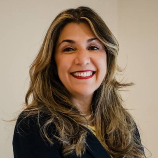 Smiling photo of Anne-Marie Cade against white background