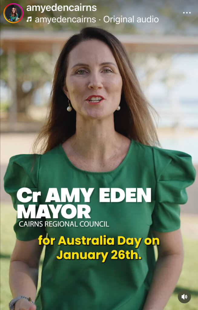 Screengrab of Amy Eden wearing a green dress, speaking to camera
