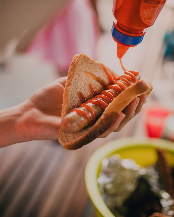 Close up of a sausage in bread