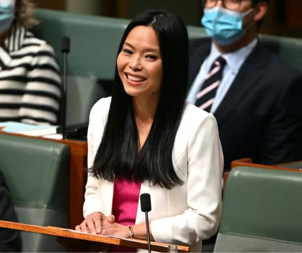 Photo of Sally Sitou MP smiling at podium in Federal Parliament
