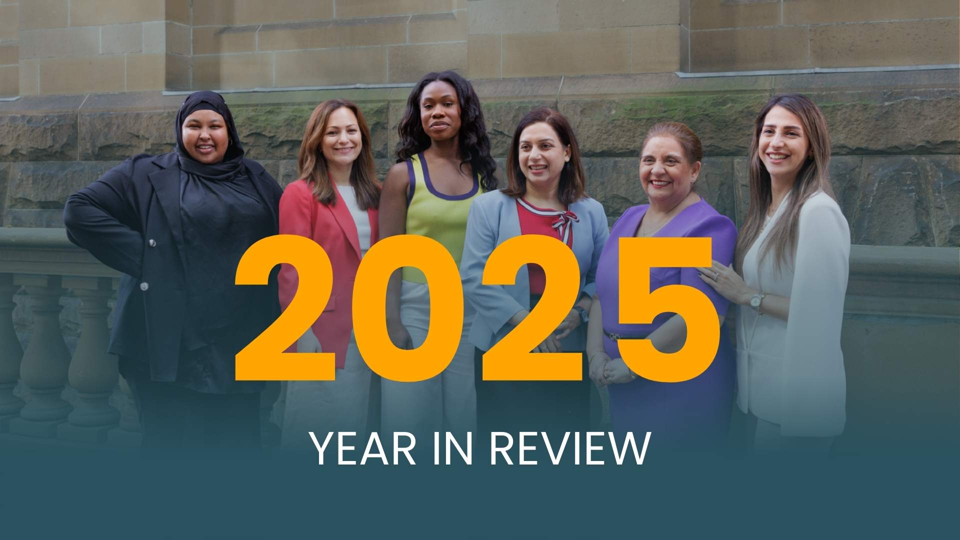 Group of diverse colourfully dressed women csmiling against an old stone wall, with text reading "2025 year in review" overlaid