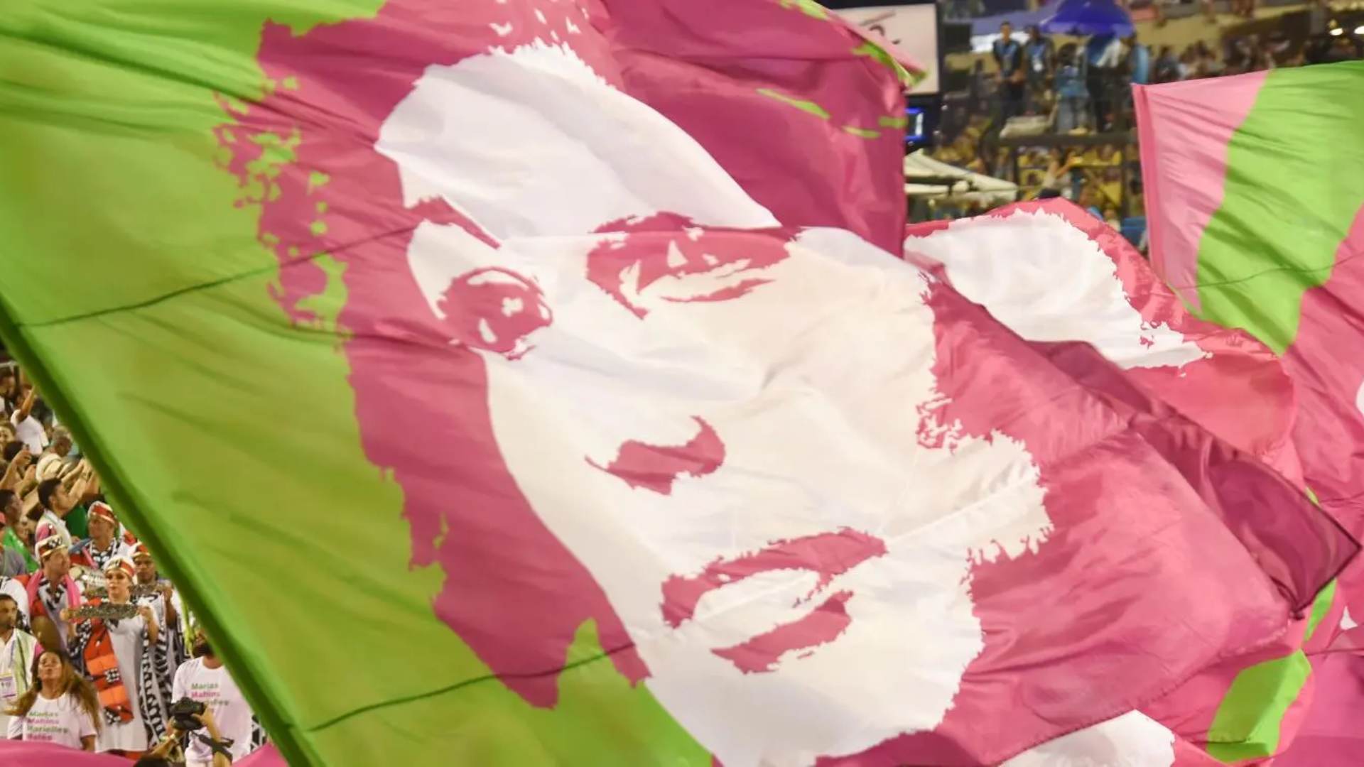 Colourful pink and green illustration of a woman on a large flag