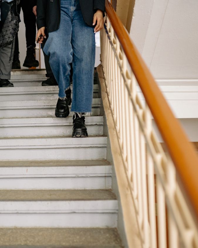 Photo of staircase with wooden handrail